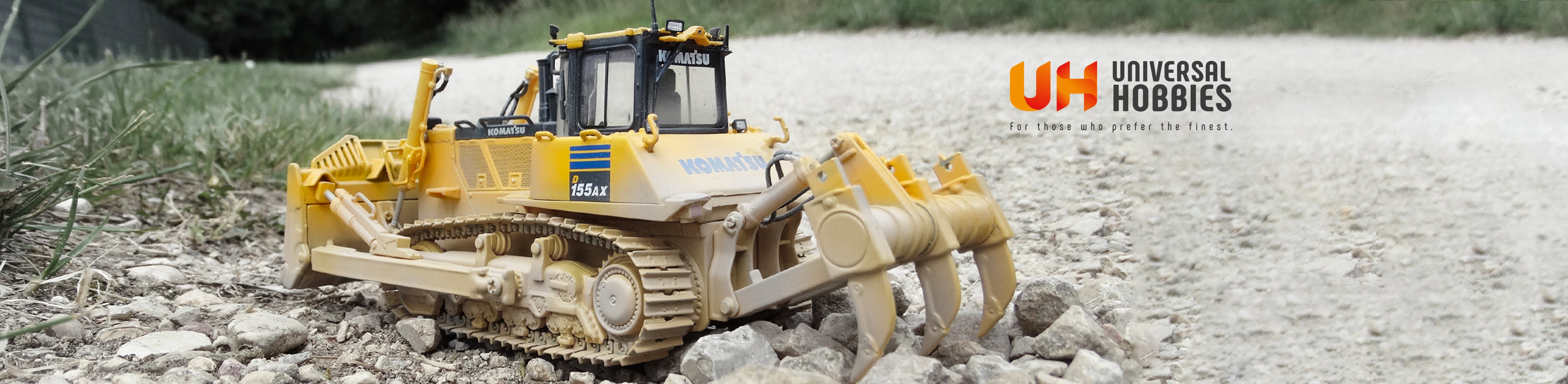 landschap met schaalmodel van een constructie machine van het merk komatsu.