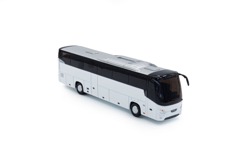 zij/vooraanzicht van een witte VDL Futura miniatuurbus in de schaal 1 op 87.