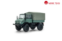 Vooraanzicht van groene Mercedes - Benz Unimog 406 (U84) met gesloten cabine in schaal 1:32