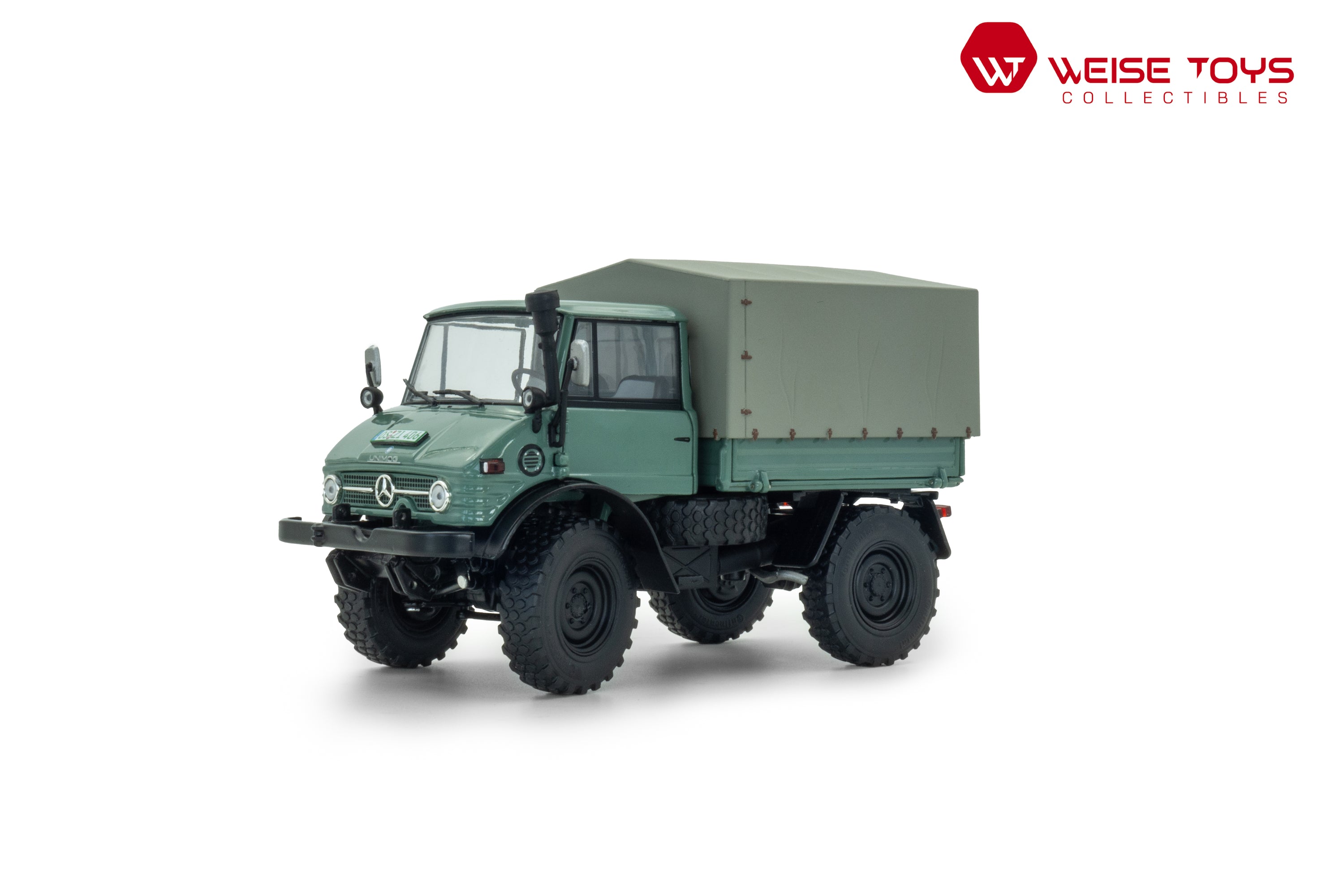 Vooraanzicht van groene Mercedes - Benz Unimog 406 (U84) met gesloten cabine in schaal 1:32